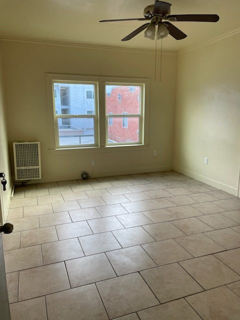 Room with ceiling fan and windows
